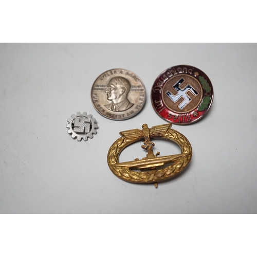 1538 - Four German WWII badges including a Kriegsmarine submarine war badge, makers mark Frank and Reif  S... 