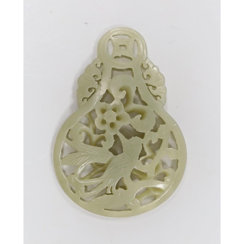 1547 - A Chinese celadon jade reticulated pendant. 7cm tall