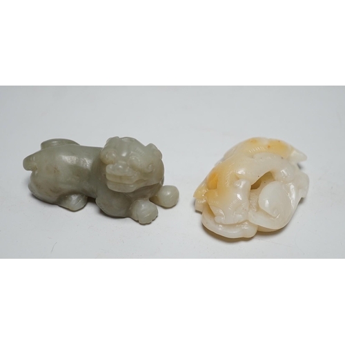 1548 - A Chinese white and russet Jade chilong carving and a celadon jade figure of a lion-dog,  7cm