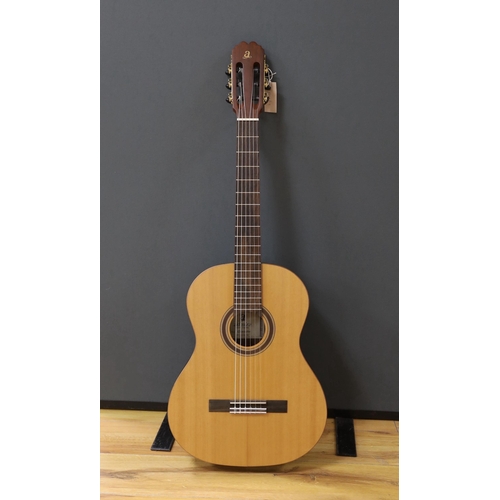 1587 - An Admira 'Concerto' classical guitar. Cedar top, satin finish with rosewood back and sides