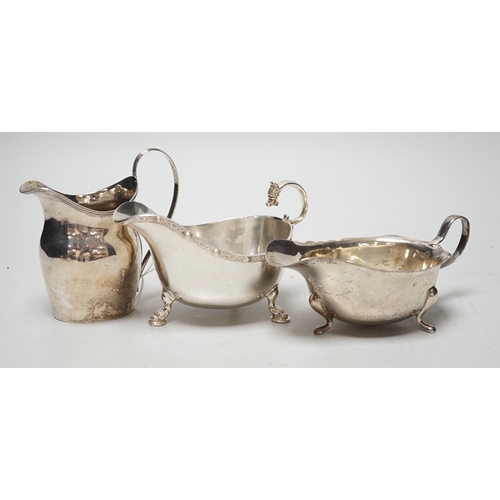 1817 - A George III silver cream jug, London, 1801, height 11cm, together with two later silver sauceboats,... 