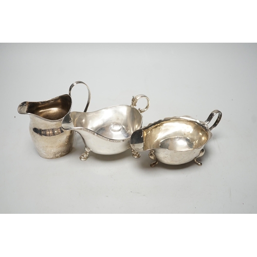 1817 - A George III silver cream jug, London, 1801, height 11cm, together with two later silver sauceboats,... 