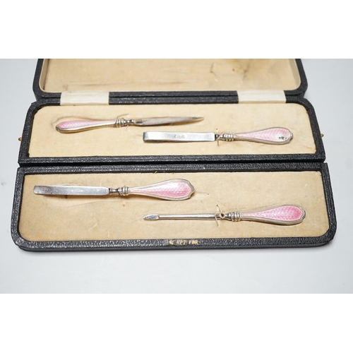 1839 - A cased George V nine piece silver and pink enamel mounted manicure set.