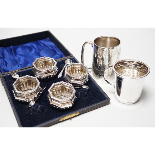 1843 - A late Victorian engraved silver christening cup, a later silver christening cup and a cased set of ... 