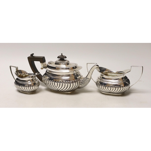 1845 - An Edwardian three piece demi-fluted silver tea set, Birmingham, 1905, gross 21.1oz.