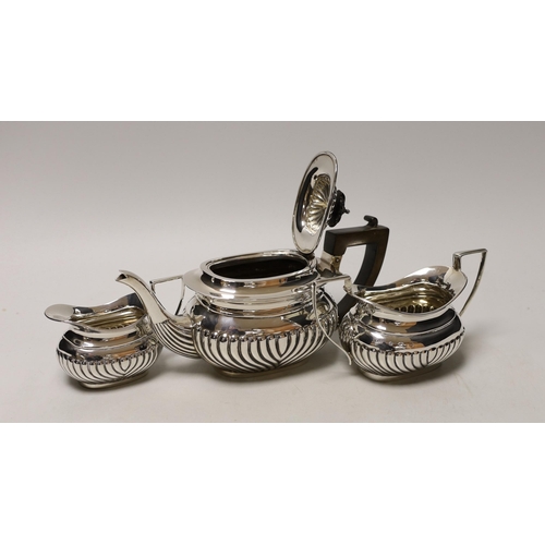 1845 - An Edwardian three piece demi-fluted silver tea set, Birmingham, 1905, gross 21.1oz.