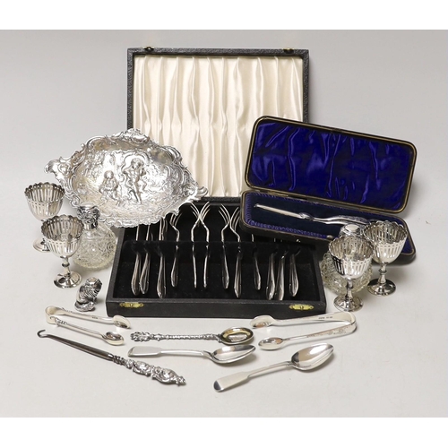 1847 - Sundry small silverwares including flatware, a pair of mounted glass scent bottles, a white metal Ge... 