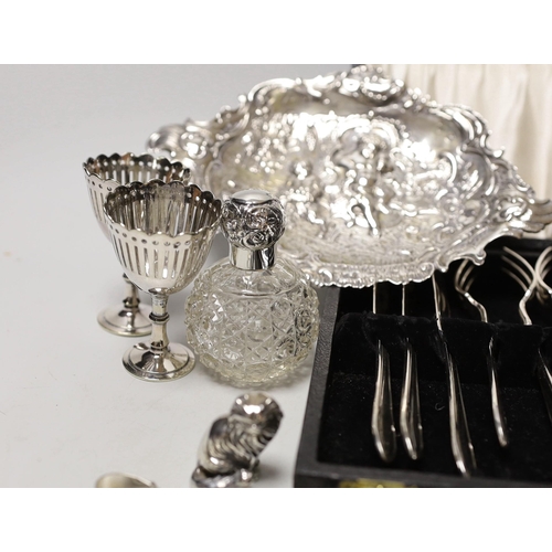 1847 - Sundry small silverwares including flatware, a pair of mounted glass scent bottles, a white metal Ge... 