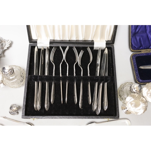 1847 - Sundry small silverwares including flatware, a pair of mounted glass scent bottles, a white metal Ge... 