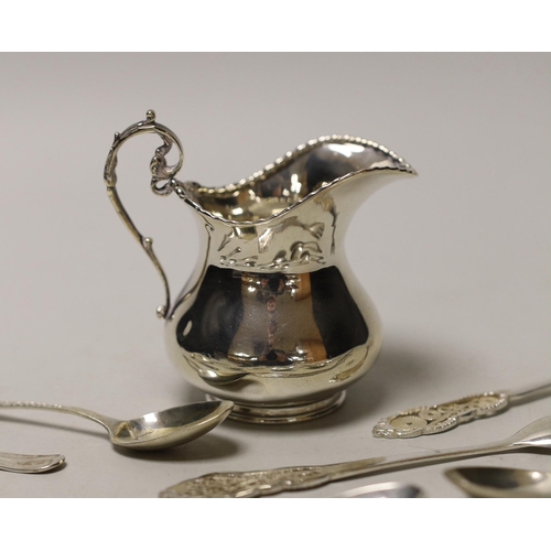 1850 - A silver cream jug and sundry minor spoons and forks.