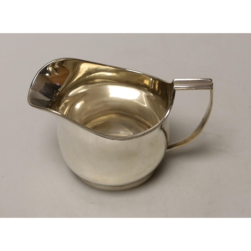 1851 - A George III silver helmet shaped cream jug, London, 1810, 10cm, 5.8oz.