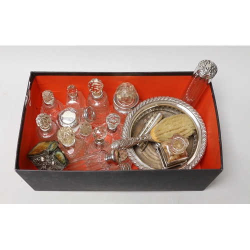 1852 - A collection of assorted silver mounted glass scent bottles and other items including a wine coaster... 