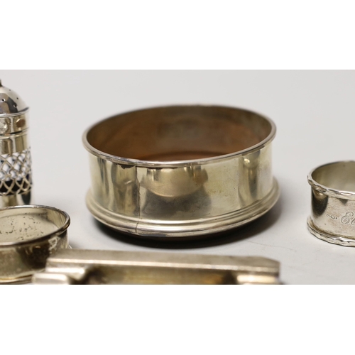 1853 - A silver coaster, ashtray, two napkin rings, cutlery etc.