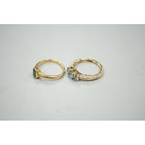 1878 - A modern 18ct gold and single stone emerald set ring, size M, gross weight 4 grams and a modern 14k ... 