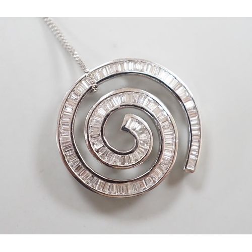 1882 - A modern 750 white metal and baguette cut diamond set whorl design pendant, 22mm, gross 4.5 grams, o... 