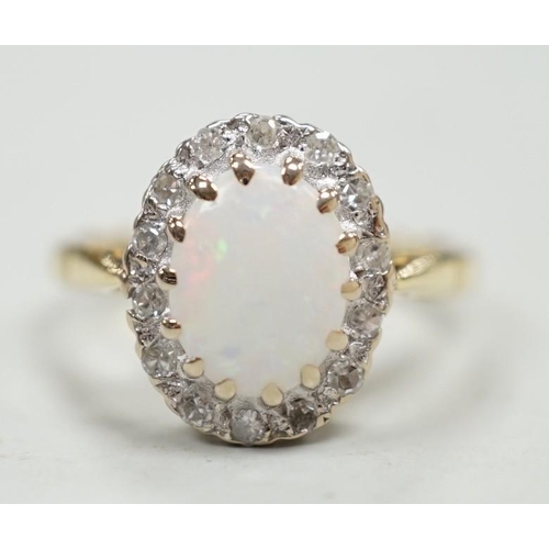 1883 - A modern 18ct white gold white opal and diamond set oval cluster ring, size M, gross weight 4.3 gram... 