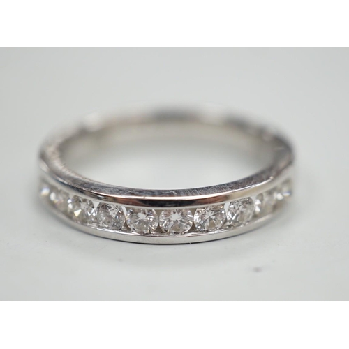 1884 - A modern 18k white metal and ten stone channel set diamond half eternity ring, size L/M, gross weigh... 