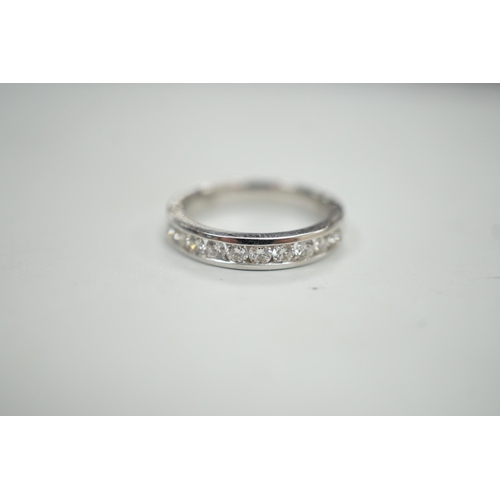 1884 - A modern 18k white metal and ten stone channel set diamond half eternity ring, size L/M, gross weigh... 