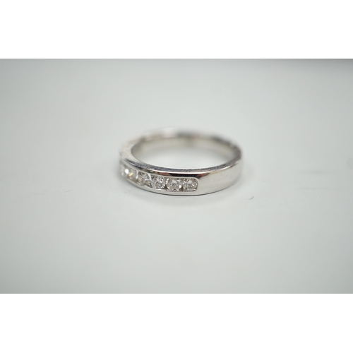 1884 - A modern 18k white metal and ten stone channel set diamond half eternity ring, size L/M, gross weigh... 