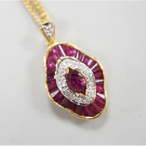 1888 - A modern 18k yellow metal, ruby and diamond cluster set quatrefoil shaped pendant, overall 25mm, on ... 