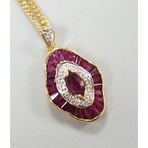 1888 - A modern 18k yellow metal, ruby and diamond cluster set quatrefoil shaped pendant, overall 25mm, on ... 