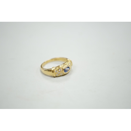 1892 - A modern 18ct gold, single stone oval cut sapphire and ten stone diamond chip set ring, size N/O, gr... 