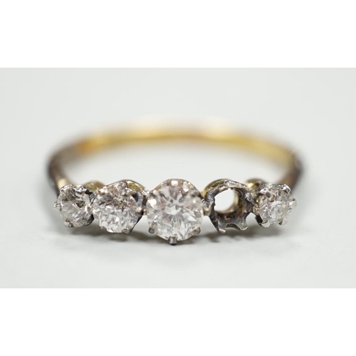 1902 - An 18ct and graduated five stone diamond set half hoop ring, size P, gross weight 1.9 grams, one sto... 