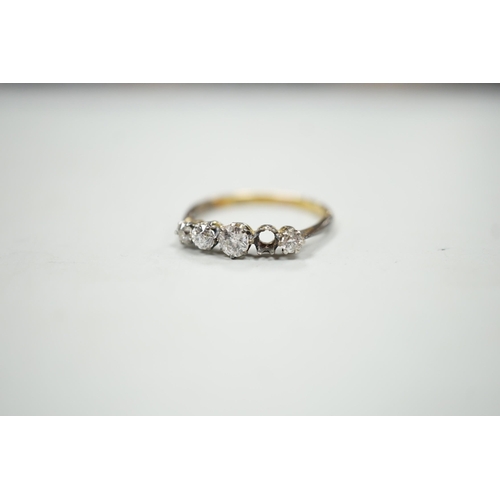 1902 - An 18ct and graduated five stone diamond set half hoop ring, size P, gross weight 1.9 grams, one sto... 