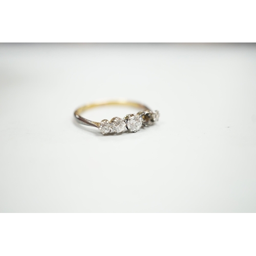 1902 - An 18ct and graduated five stone diamond set half hoop ring, size P, gross weight 1.9 grams, one sto... 