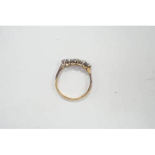 1902 - An 18ct and graduated five stone diamond set half hoop ring, size P, gross weight 1.9 grams, one sto... 