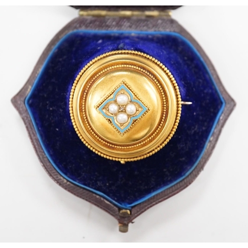 1903 - A cased Victorian yellow metal, enamel and split pearl set circular mourning pendant brooch, the gla... 