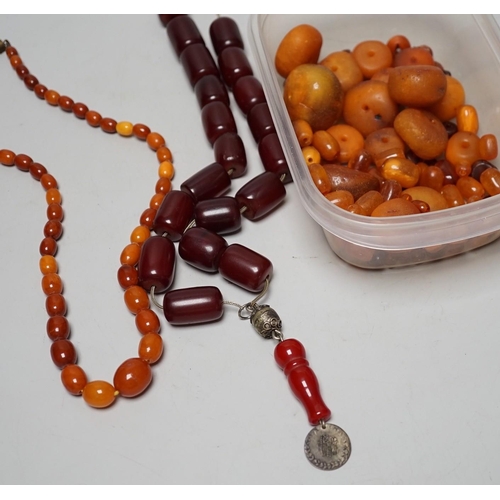 1904 - A single strand graduated amber bead necklace, 54cm gross weight 30 grams, together with loose amber... 