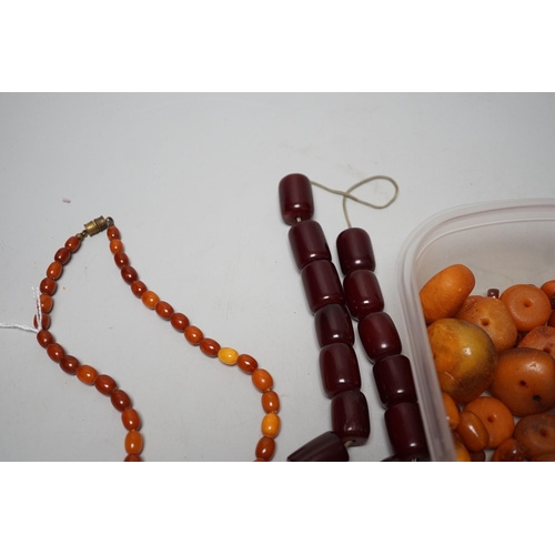 1904 - A single strand graduated amber bead necklace, 54cm gross weight 30 grams, together with loose amber... 