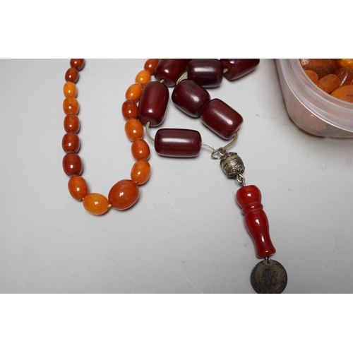 1904 - A single strand graduated amber bead necklace, 54cm gross weight 30 grams, together with loose amber... 