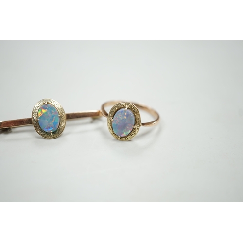 1922 - A 9ct and black opal doublet set bar brooch, 38mm and a matching ring, size R, gross weight 5.9 gram... 