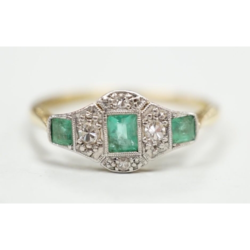 1923 - A 1920's 18ct & plat, millegrain set three stone emerald and four stone diamond ring, size R/S, gros... 