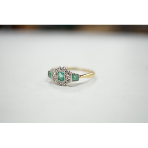 1923 - A 1920's 18ct & plat, millegrain set three stone emerald and four stone diamond ring, size R/S, gros... 