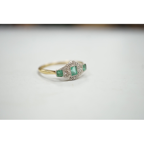 1923 - A 1920's 18ct & plat, millegrain set three stone emerald and four stone diamond ring, size R/S, gros... 