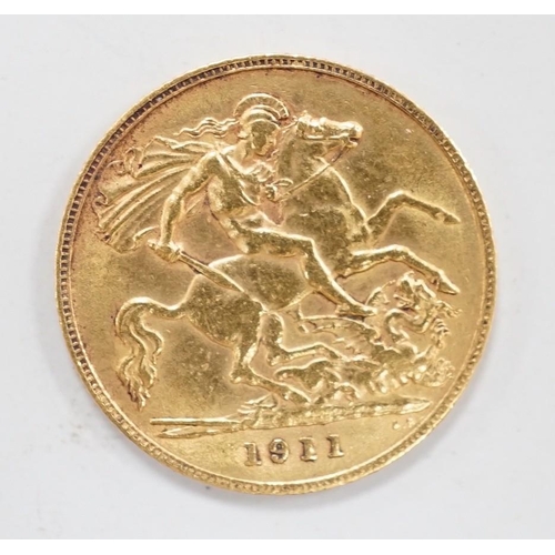 1926 - A George V 1911 gold half sovereign, with leather purse.