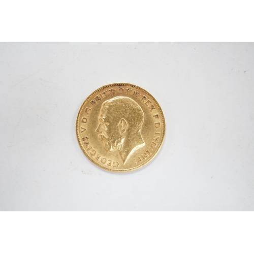 1926 - A George V 1911 gold half sovereign, with leather purse.