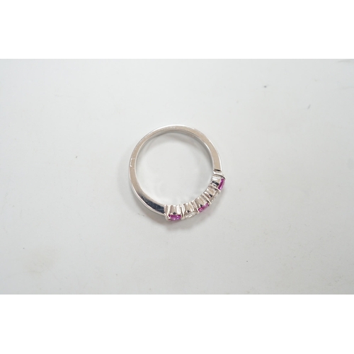 1928 - A modern 18ct white gold, three pink stone and two stone diamond set half hoop ring, size M, gross w... 