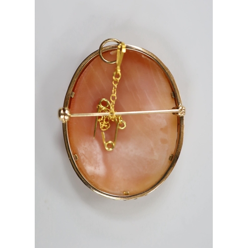 1939 - A modern 9ct gold mounted oval cameo shell pendant brooch, carved with The Three Graces, 41mm, gross... 