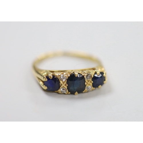 1942 - An early to mid 20th century gold, three stone sapphire and four stone diamond chip set half hoop ri... 