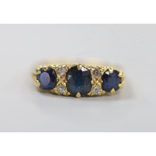 1942 - An early to mid 20th century gold, three stone sapphire and four stone diamond chip set half hoop ri... 