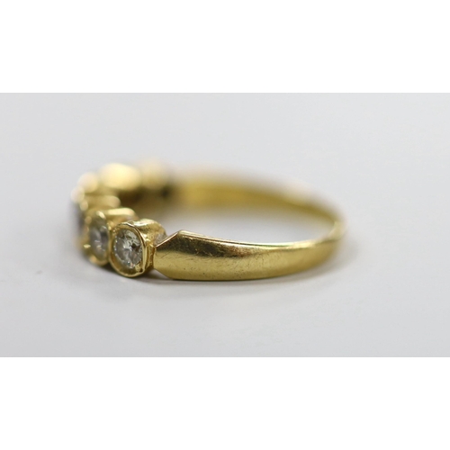 1943 - A modern 750 yellow metal and seven stone diamond set half hoop ring, size O, gross weight 3.2 grams... 