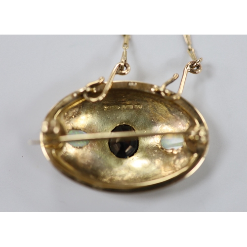 1944 - A 1970's 9ct gold and gypsy set single stone sapphire and two stone white opal set oval pendant broo... 