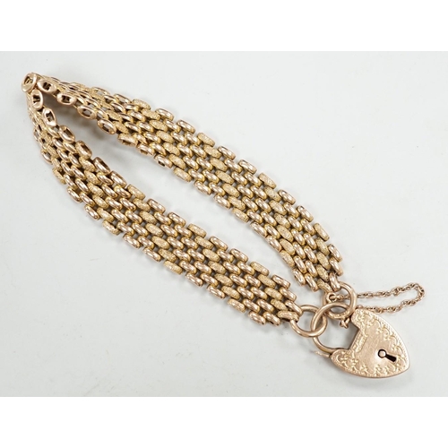 1947 - An early 20th century yellow metal (stamped 9c) gate link bracelet, with heart shaped padlock clasp,... 