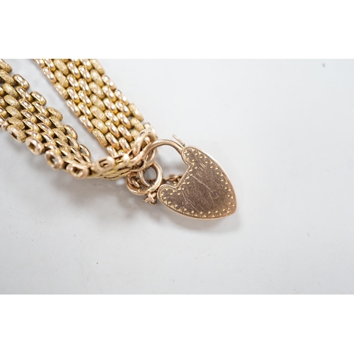 1947 - An early 20th century yellow metal (stamped 9c) gate link bracelet, with heart shaped padlock clasp,... 