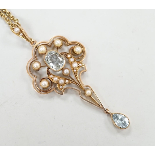 1948 - An Edwardian 15ct, aquamarine and seed pearl set drop pendant, 56mm, gross weight 5.3 grams, on a gi... 