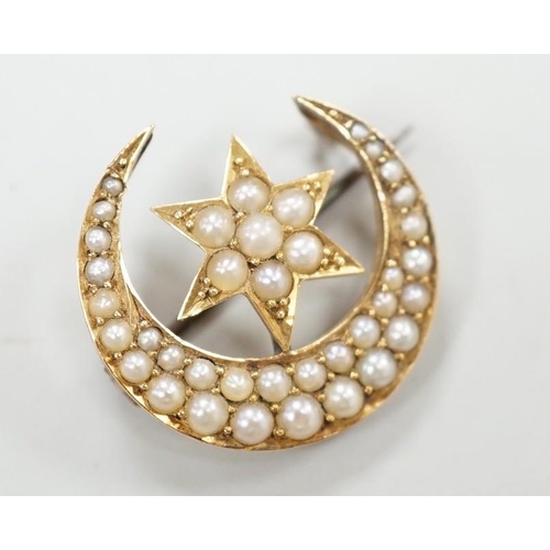 1951 - An Edwardian yellow metal and seed pearl set crescent moon and star brooch, 22mm, gross weight 4 gra... 